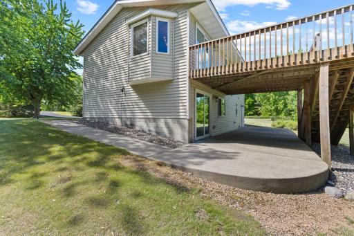 The front sidewalk wraps around the east side of the home and connects to a massive rear concrete patio!