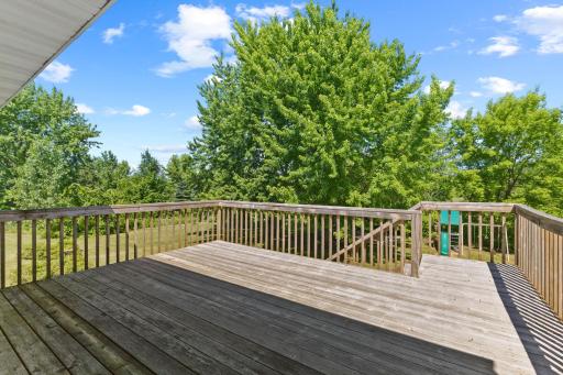The oversized deck can be accessed through the dining room patio door, and provides room for a traditional seating and dining area.