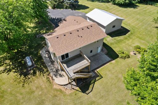 An aerial view of the back of the home and detached garage.