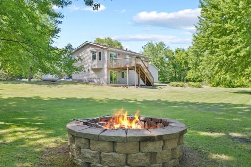 The home features three bedrooms, two bathrooms and four garage stalls between the attached and detached garages.