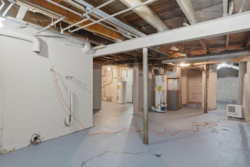 Lower level - fresh paint on floor. Separate water heaters. See Agent remarks for all utility information.