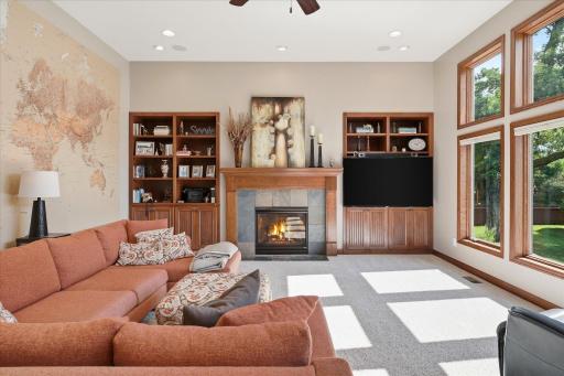 Family room with fireplace and custom built ins.