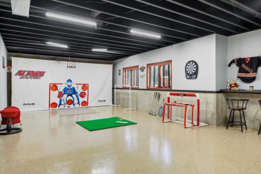 Lower level bonus room set up for recreation.