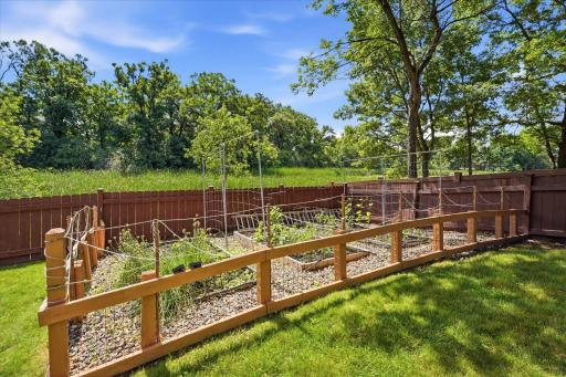 Garden beds to the back right of the property.