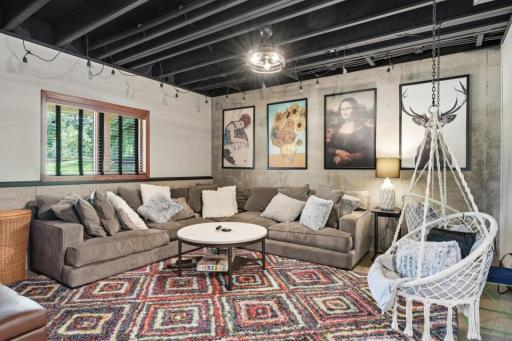 Living room on lower level with an urban industrial vibe.