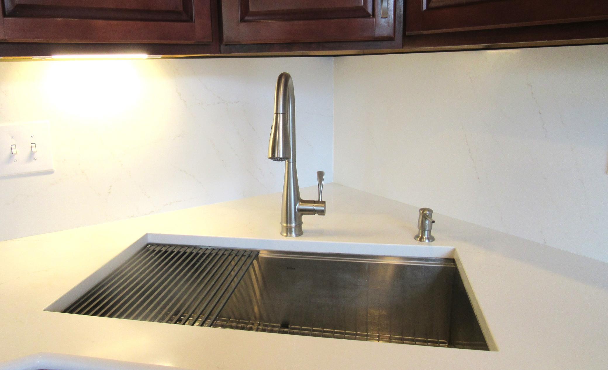 The farm sink has a new pull-out faucet.