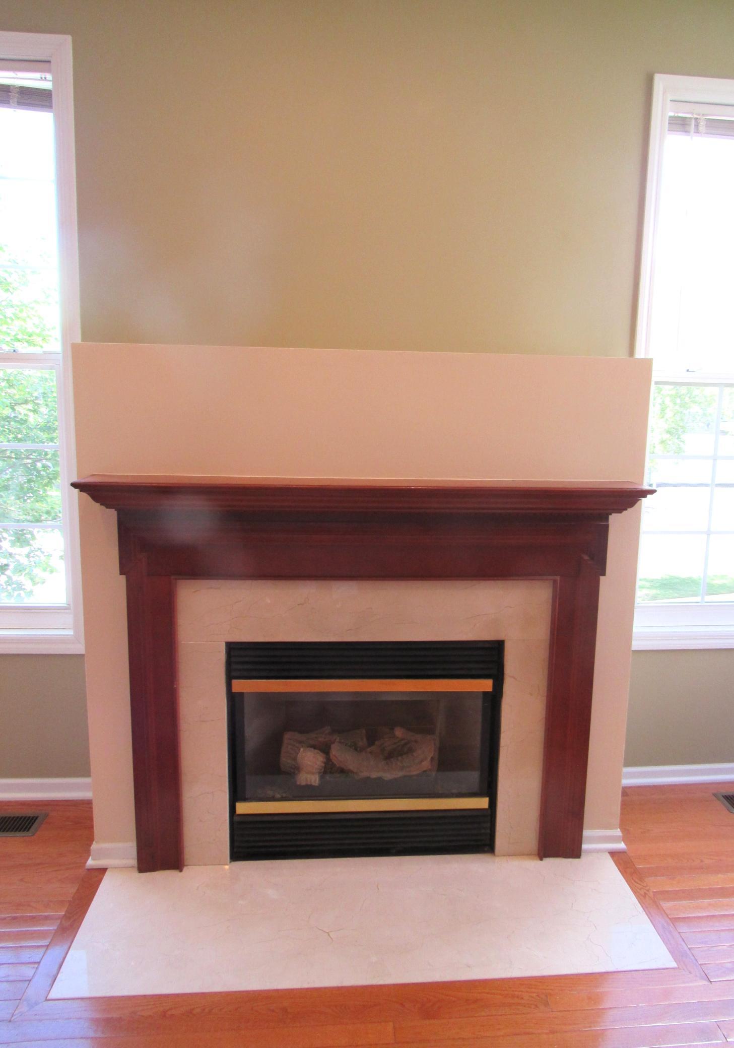 The gas fireplace is the center of the family room. Flip a switch and warm up in the cold months.