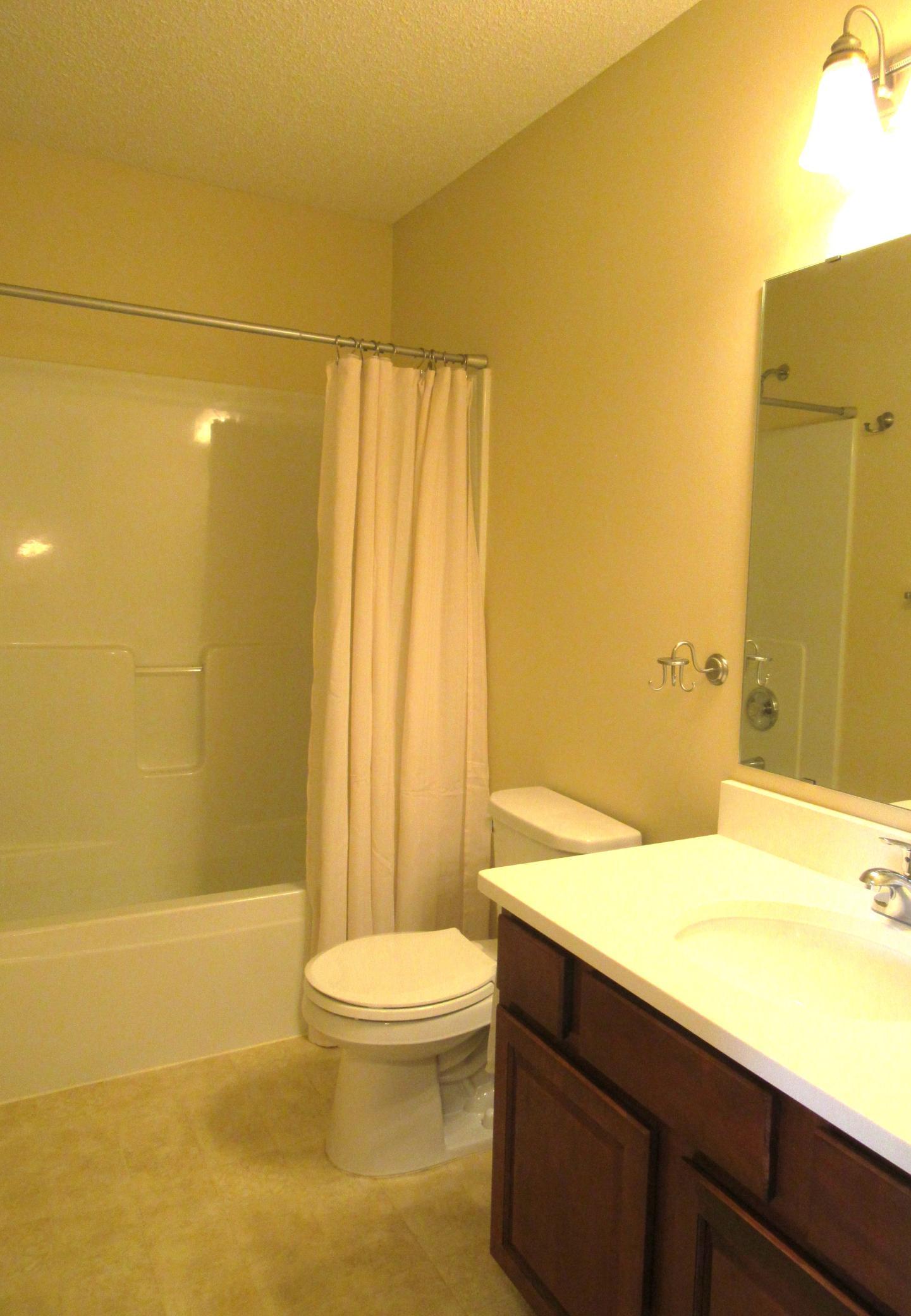 Full bath on the upper level with new quartz counter, Kohler pop up drain, nice vanity and tub surround.