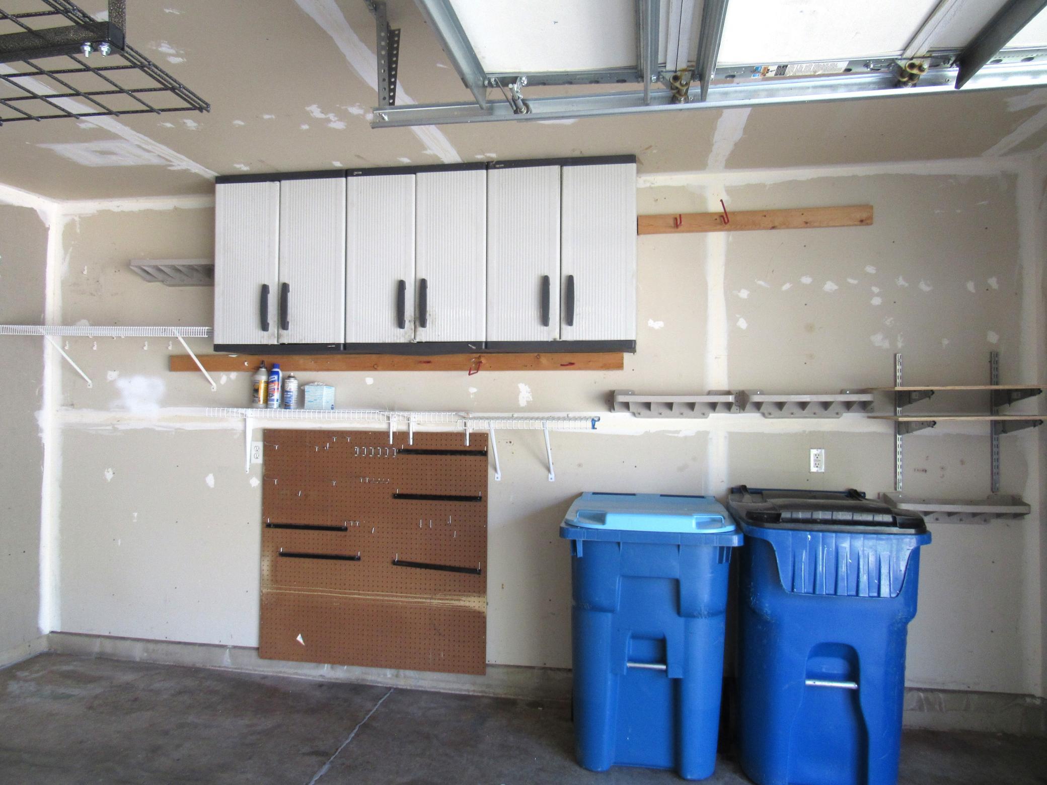 Black and Decker cabinets and assorted shelving.