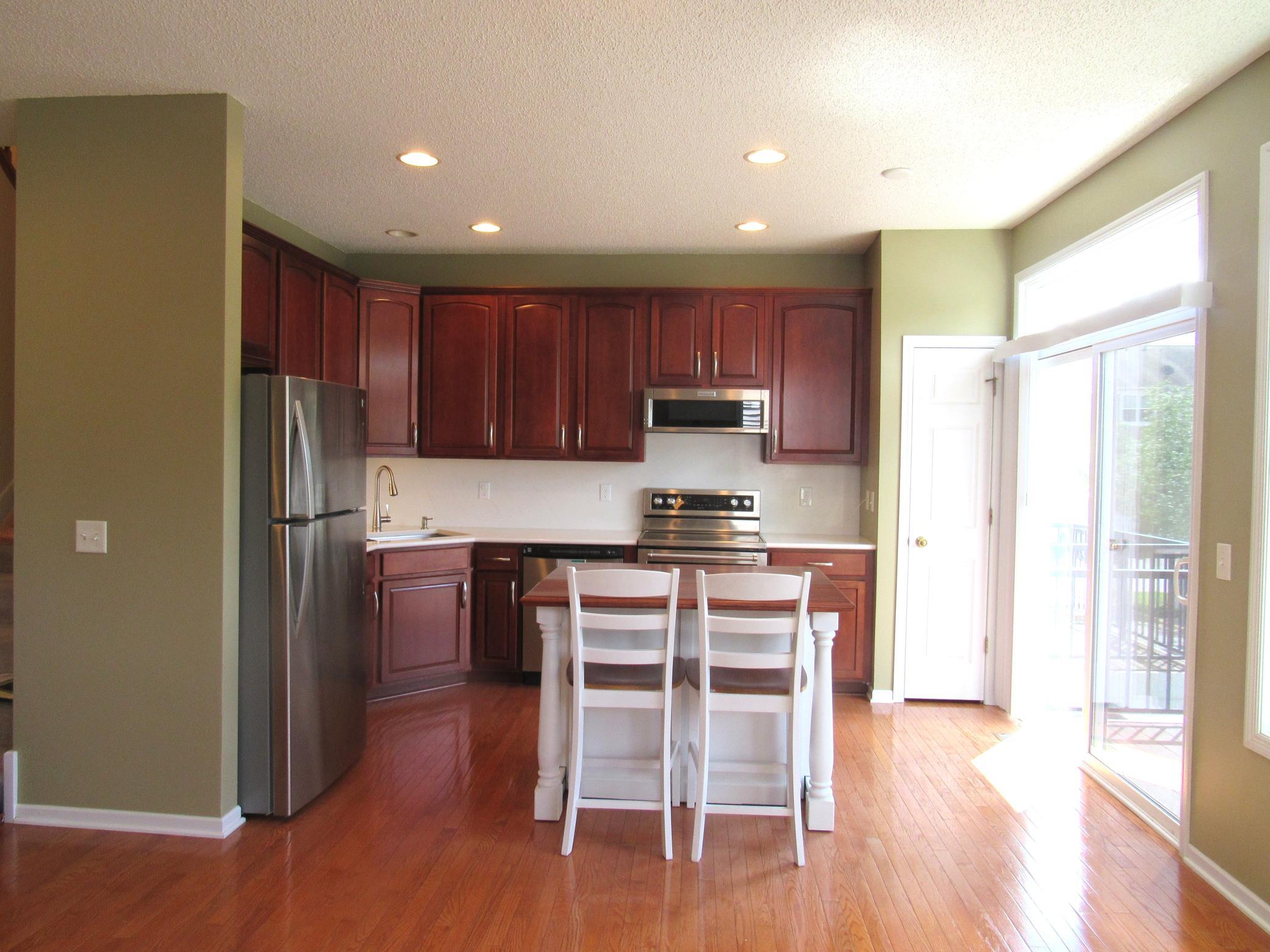The kitchen and family room have recessed lighting and wood floors. This home has fresh paint throughout and has many updates.