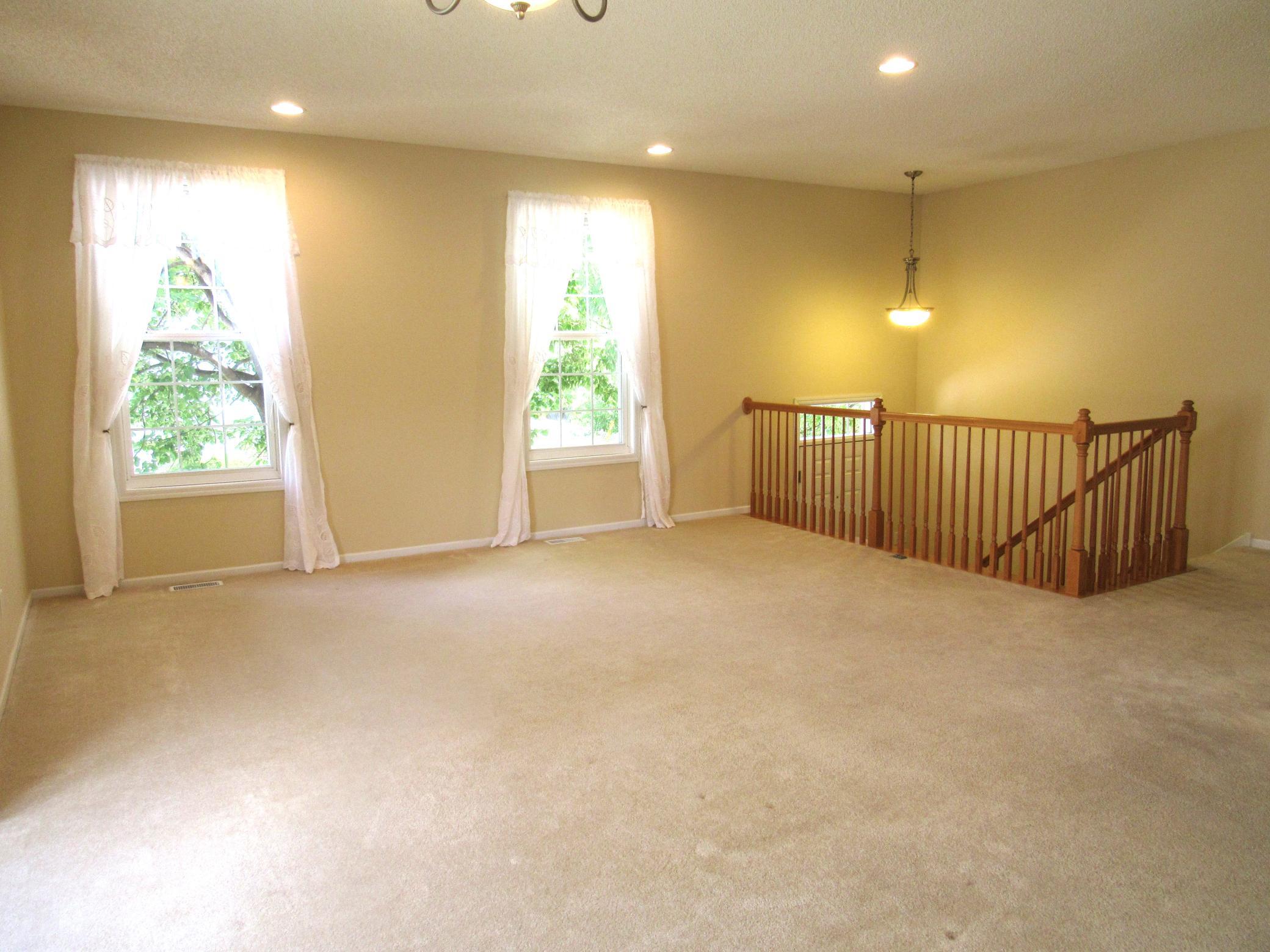 Just look at the space in this home! This end unit has so many updates and amenities. All beautiful wood railings, 6 panel doors, clean white trim, freshly painted throughout, fantastic lighting from the natural light to the recessed lights.