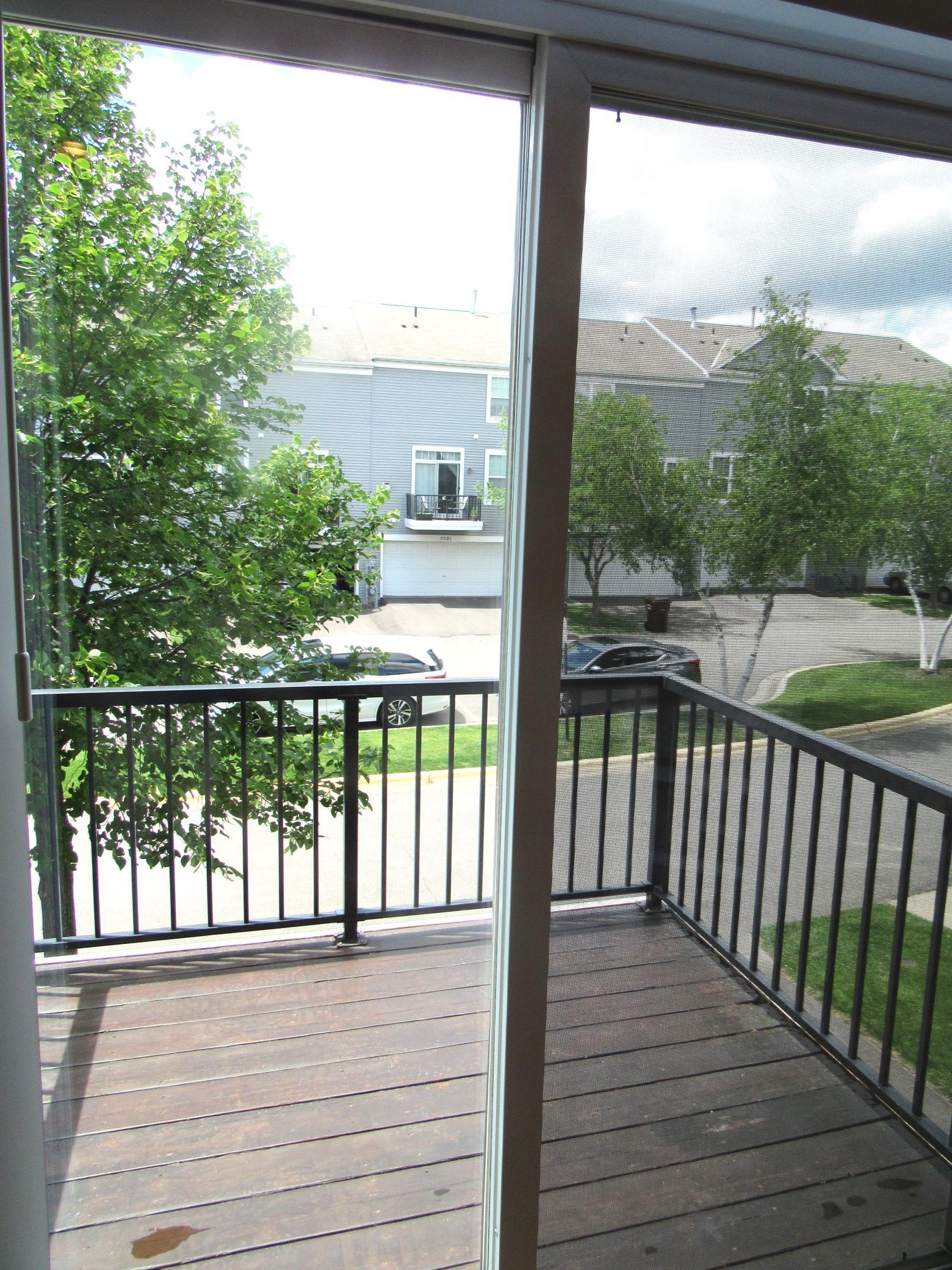 The deck is off the kitchen. There are lots of trees surrounding the townhouse for nature lovers and added privacy.