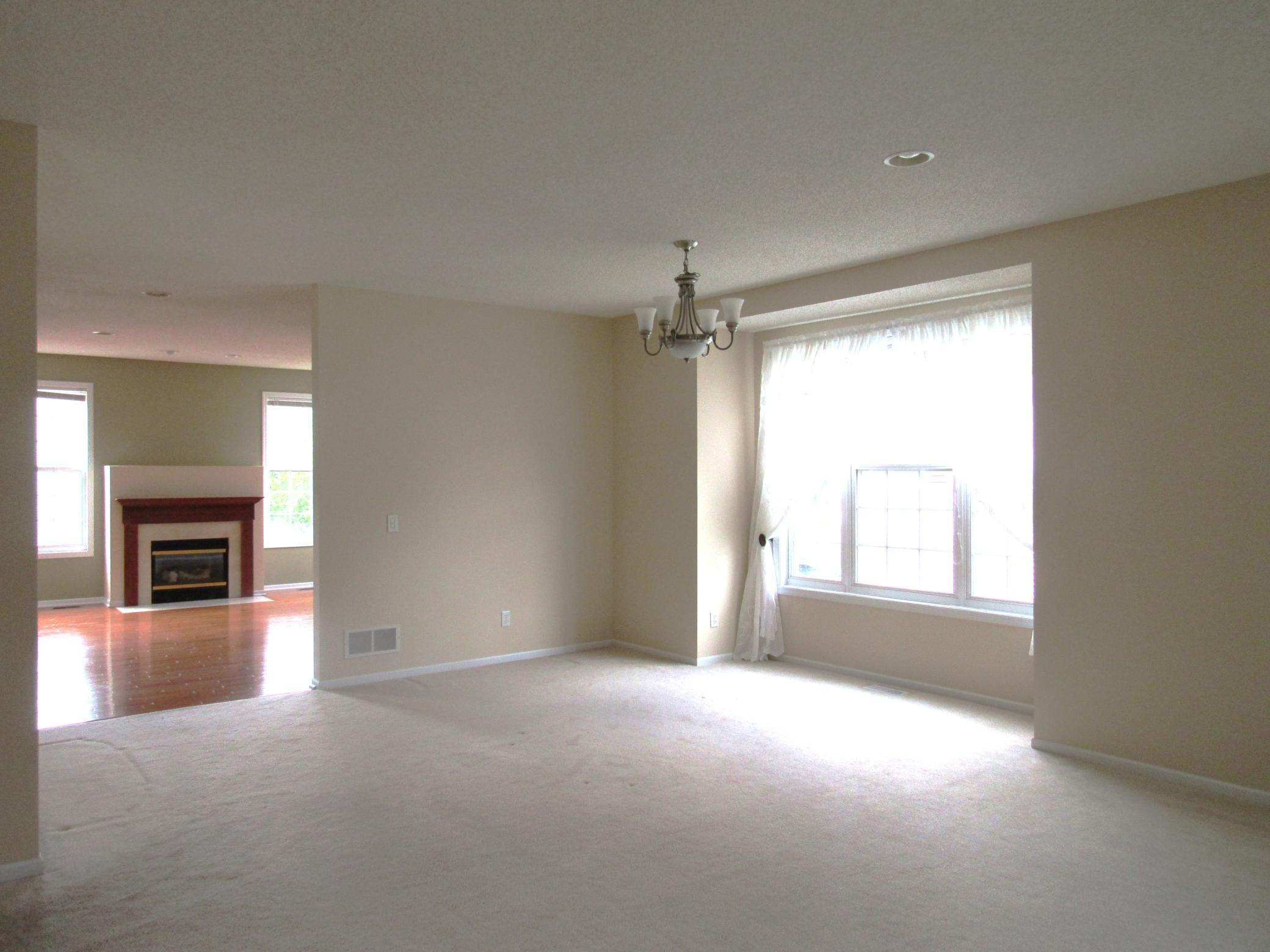 The dining space opens up to the kitchen and family room. This home is wonderful for entertaining! There are 3 living spaces all with a different feel. The living room/dining room can flow into the kitchen for a more informal gathering.