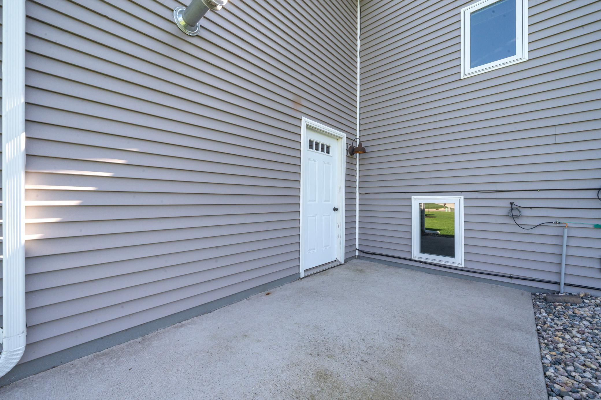 Concrete patio off of Garage