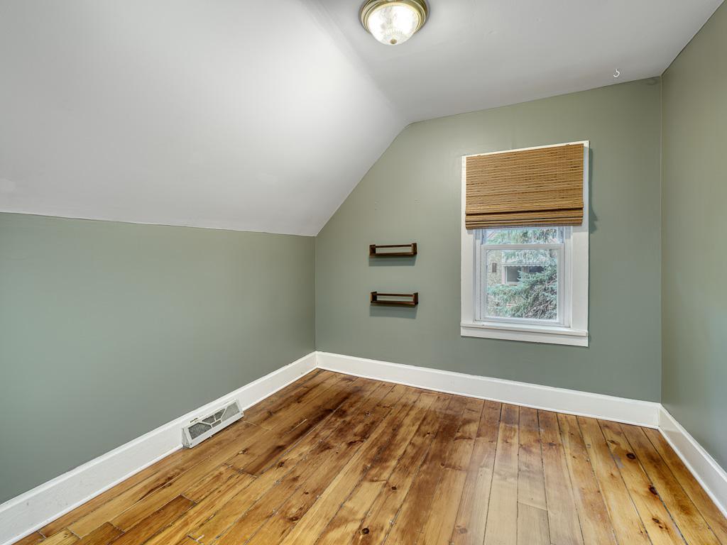 A second upstairs bedroom is roomy and includes a custom closet insert.