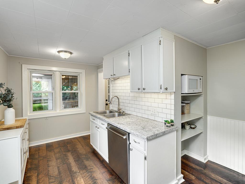 Stainless appliances and nice storage await in the kitchen.