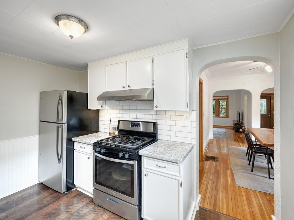 Stainless appliances and nice storage await in the kitchen.