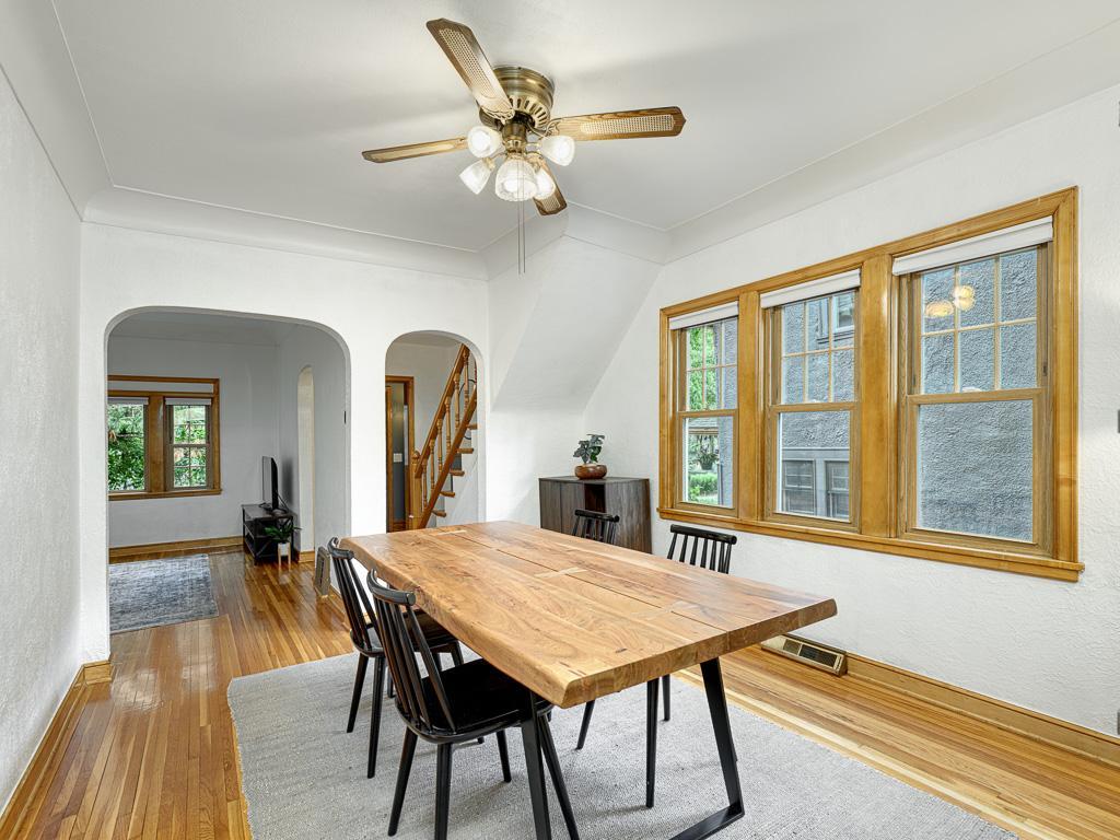 The formal dining room is a smooth transition into the kitchen, all atop gorgeous hardwood floors.