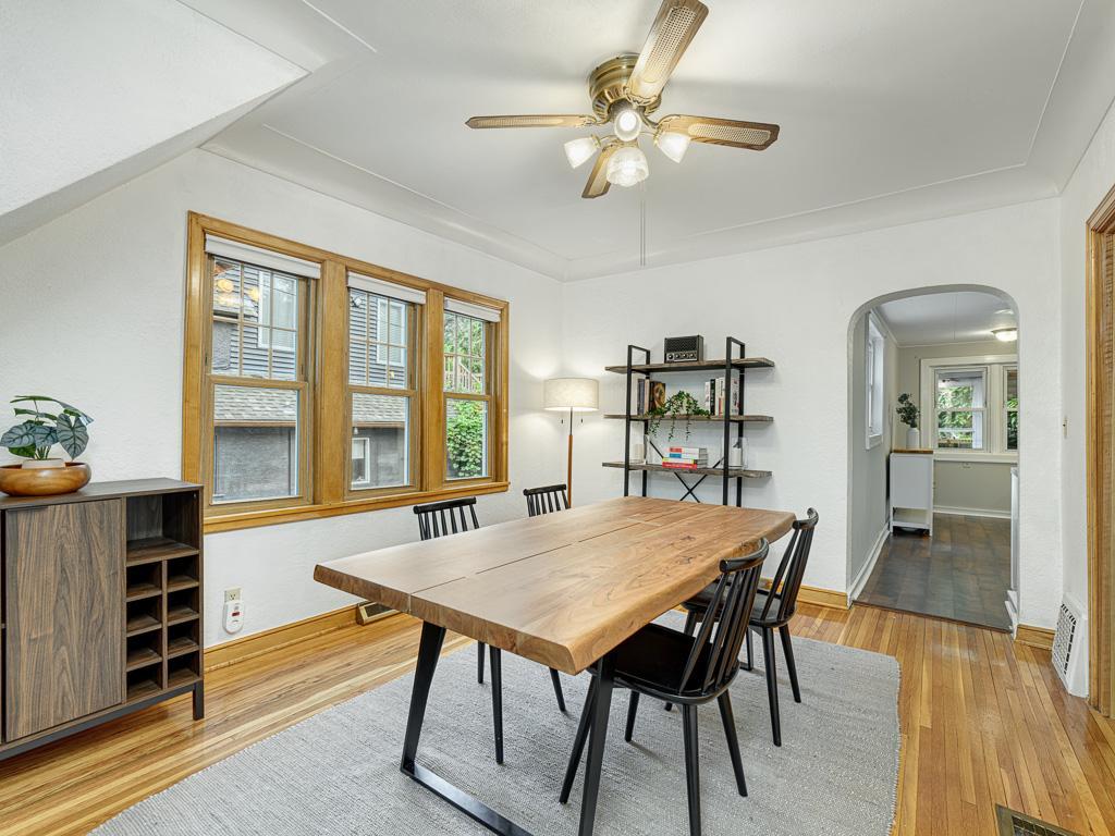 The formal dining room is a smooth transition into the kitchen, all atop gorgeous hardwood floors.