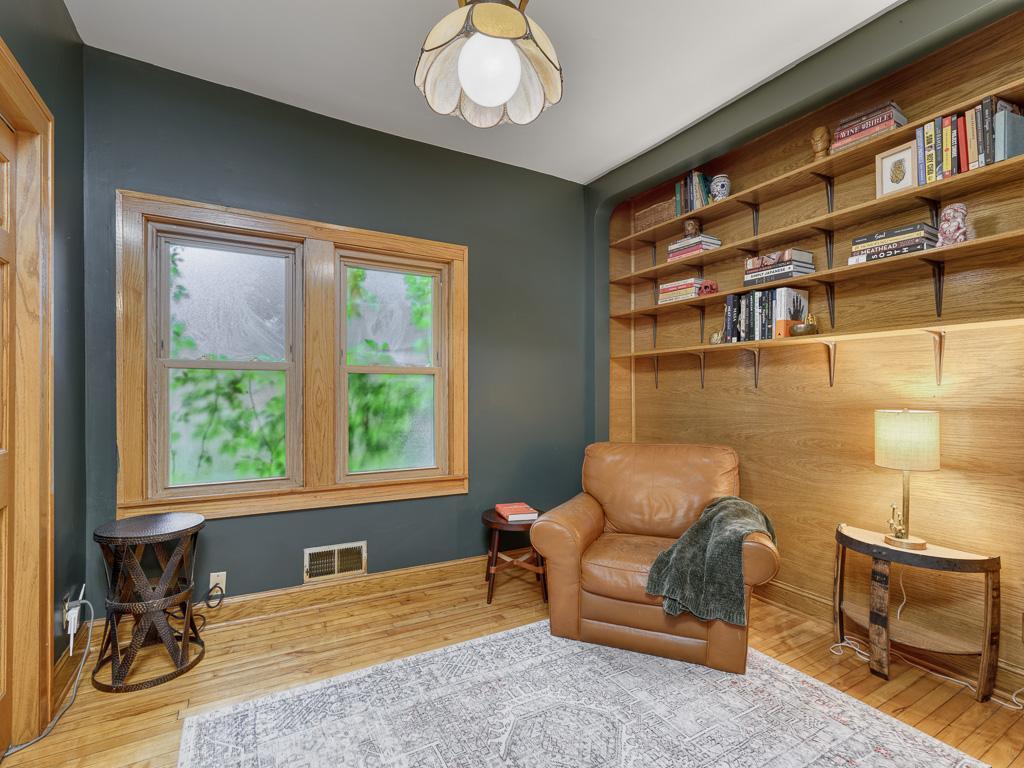 The main level bedroom is a great flex space as a bedroom, office, or tasteful lounge.