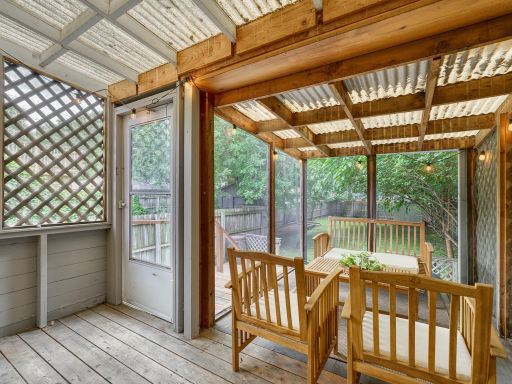 Chill in the summer months in your rear, enclosed porch.