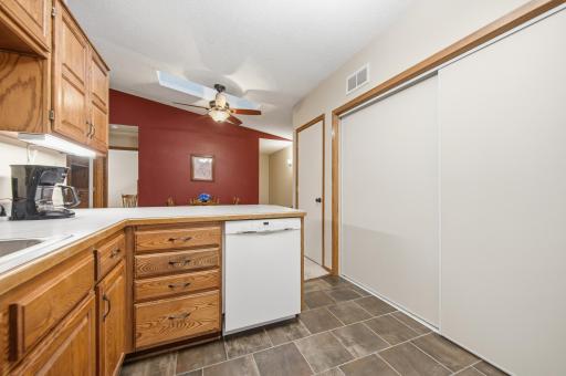 Open kitchen with a spacious breakfast bar and pass-through to the living room, creating an ideal layout for everyday living and entertaining