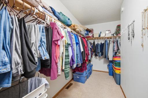 Large walk-in closet provides abundant storage and organization space.