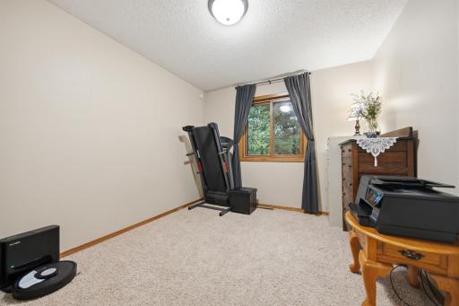 Versatile second bedroom is perfect as a guest room, home office, flex space, or home gym