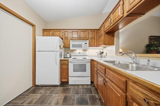 The open-concept design keeps the kitchen connected to the dining and living areasâperfect for everyday living and entertaining