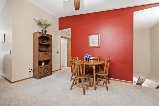 Natural light pours through the skylight, making this open dining area perfect for everyday meals and entertaining