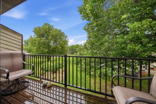 Relax on your private deck overlooking peaceful green spaceâthe perfect spot to unwind or enjoy your morning coffee.