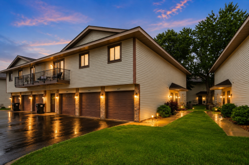 Highly sought-after upper-level townhouse offering one-level living, a private deck, and an attached garage