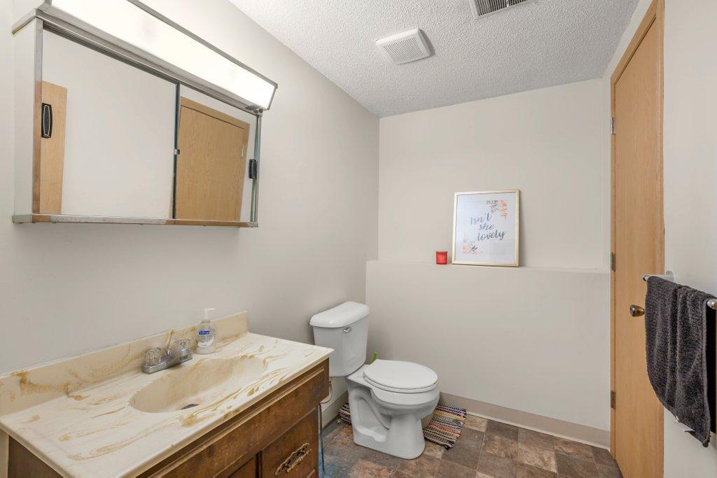 Convenient lower-level &frac34; bathroom with spacious vanity and easy access from the family room and bedrooms, ideal for busy households or overnight guests.