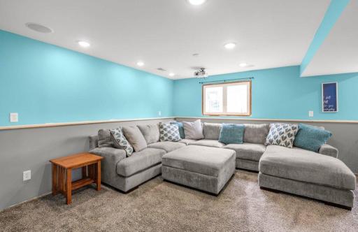 Expansive lower-level family room featuring recessed lighting, plush carpet, and plenty of space for movie nights, game days, or entertaining family and friends.