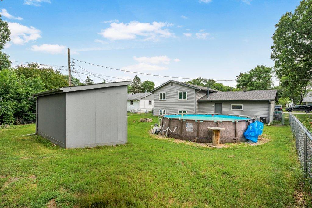 Summer is calling! Enjoy your own backyard retreat featuring an above-ground pool, spacious yard, fire pit, and storage shed for all your seasonal equipment.