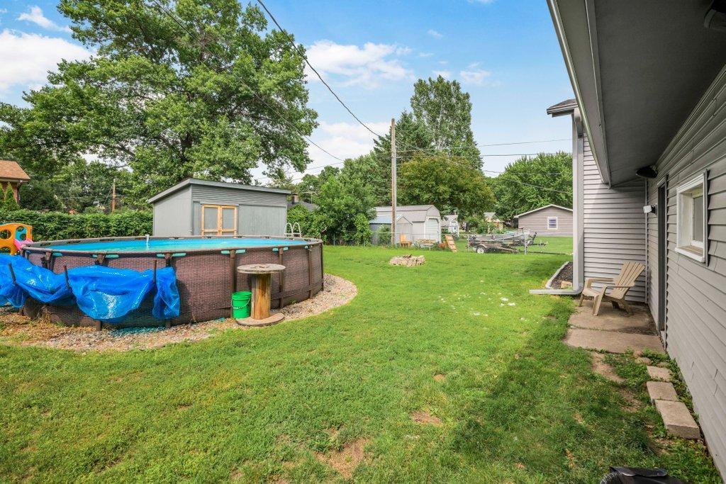 Step outside to a generous backyard designed for entertaining, complete with pool, fire pit, mature trees, and space for kids, pets, and backyard games.