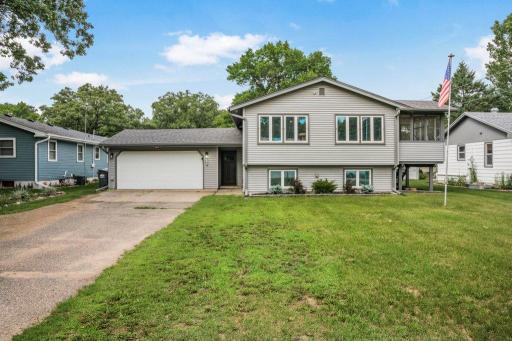 Private backyard retreat complete with fire pit, above-ground pool, screened porch, and generous green space for pets, play, gardening, or entertaining all summer long.