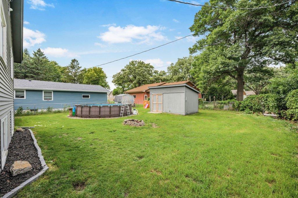 Spacious, fully usable backyard with plenty of room for play, gardening, pets, or hosting gatherings, plus a storage shed for all your outdoor essentials.
