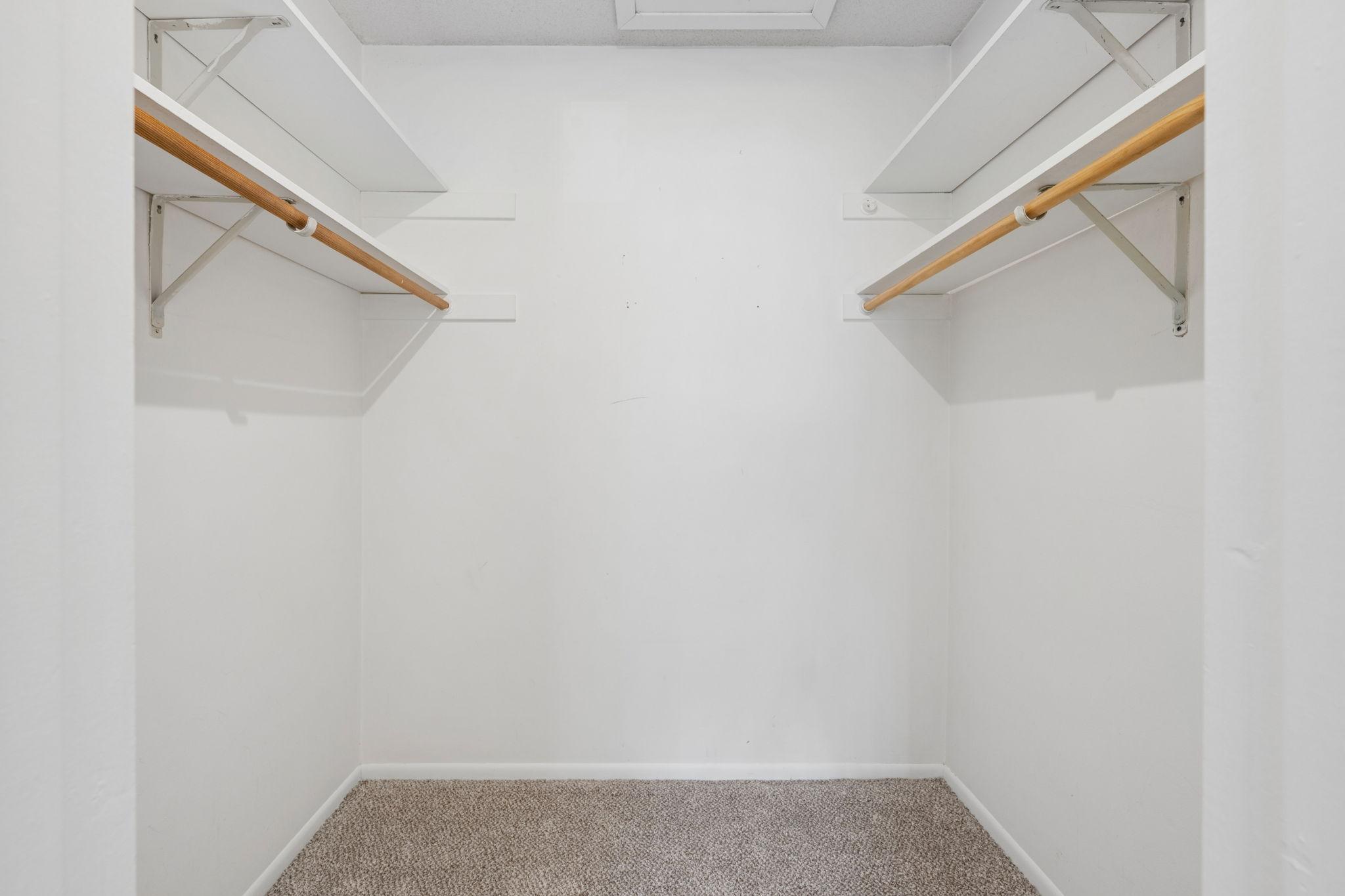 Primary bedroom walk-in closet.