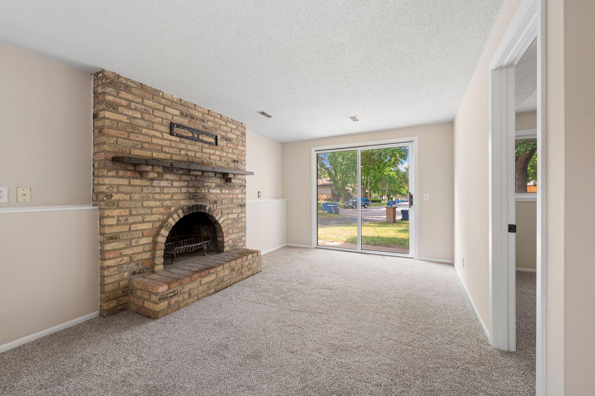 Cozy up next to the wood burning firepalce in the lower level.