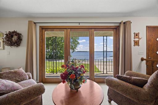 Family room offers beautiful lake views and steps out to the patio/deck