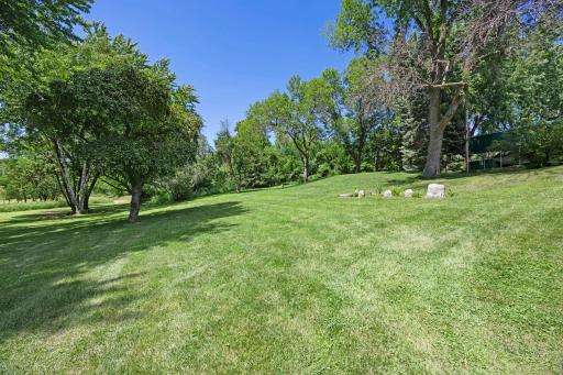 The generous yard offers endless possibilities for future expansion, gardening, recreation, or entertaining