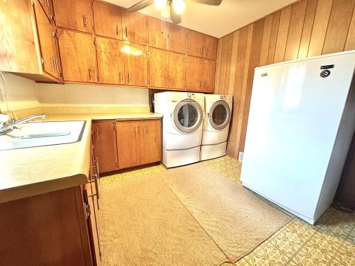 Laundry has a double sink, shower & pantry