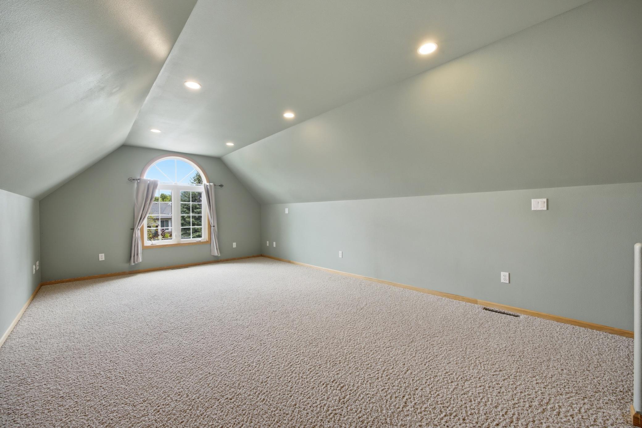 Bonus room over garage, used as primary bedroom