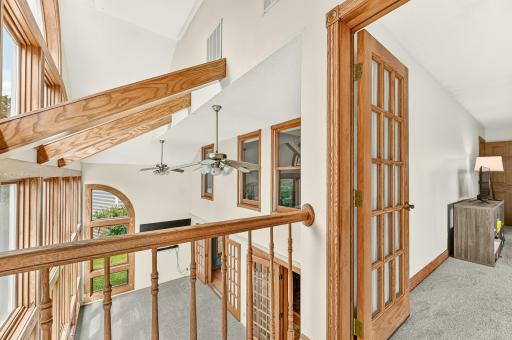Landing off the primary bedroom overlooking the sunroom.