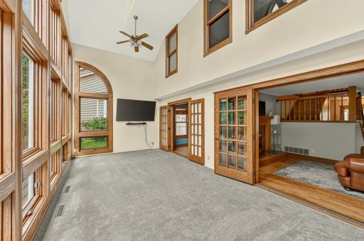 Sunroom with huge ceilings and windows