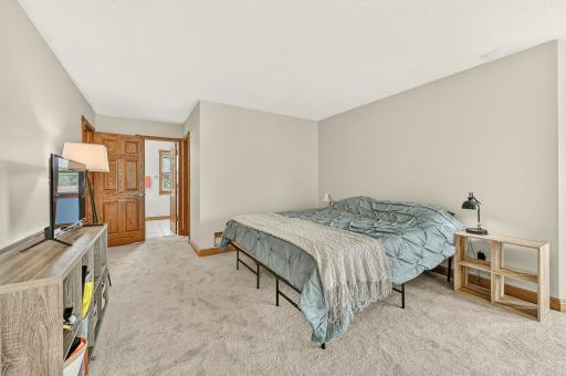 Primary bedroom with brand new carpet and fresh paint.