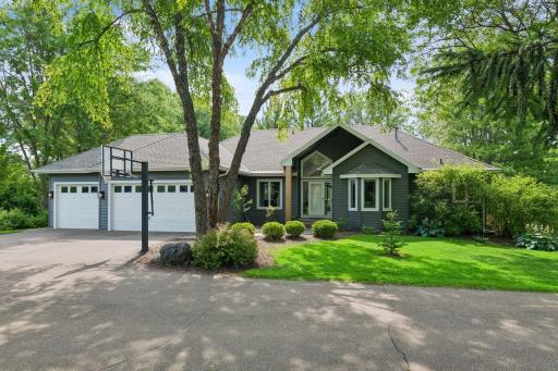 Set on 2.5 private acres among mature trees, the home features low-maintenance Ever Steel siding, a newer roof, and an attached garage with updated doors off a landscaped drive.