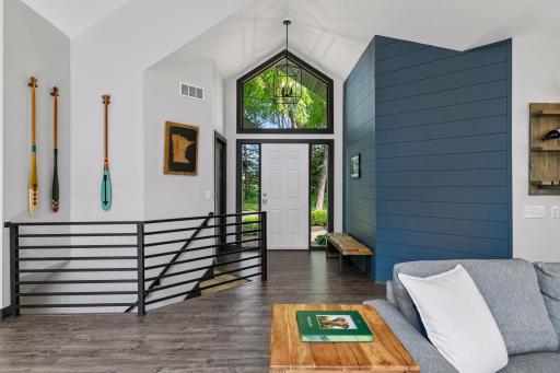 As you walk in the front entry, you are greeted with soaring ceilings, luxury vinyl plank flooring modern finishes throughout the home