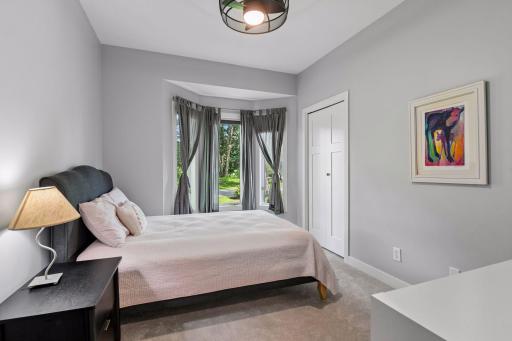 Secondary bedroom on upper level with bay window